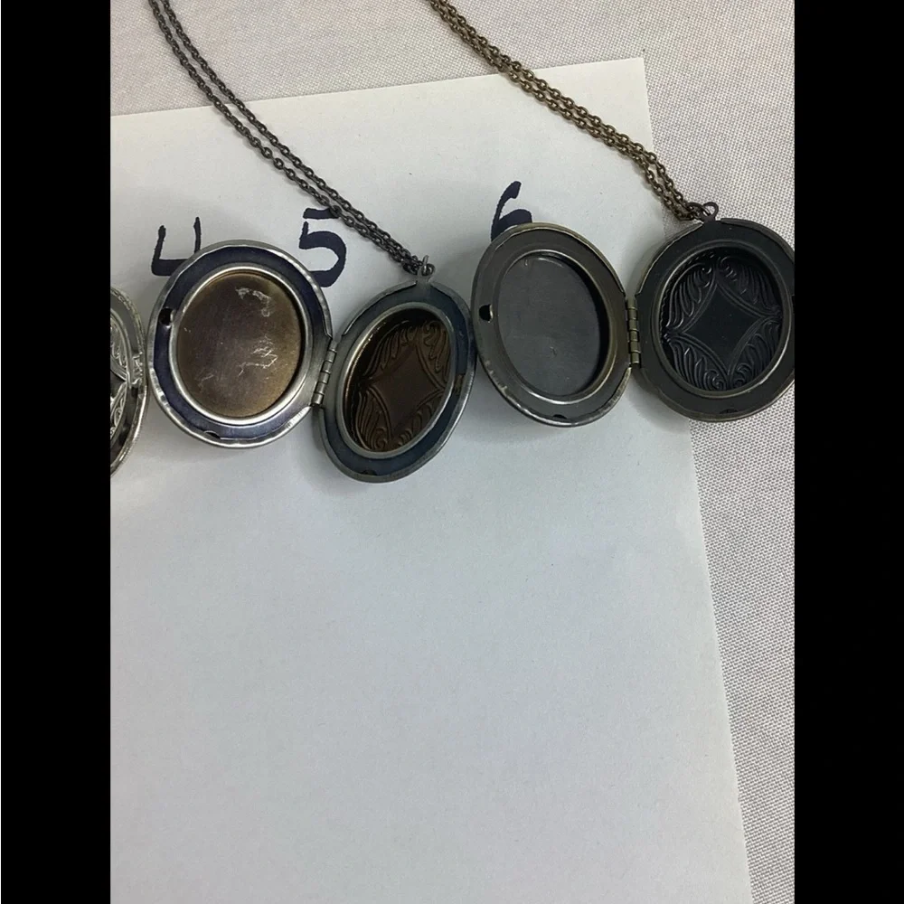 Multicolor raised cameo locket.